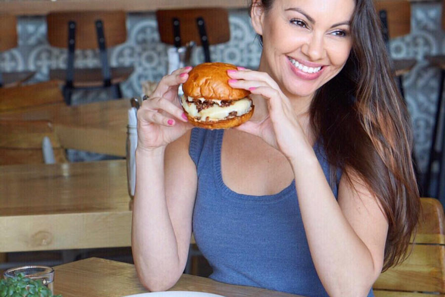 Sondra Barker eating The Cut Burger