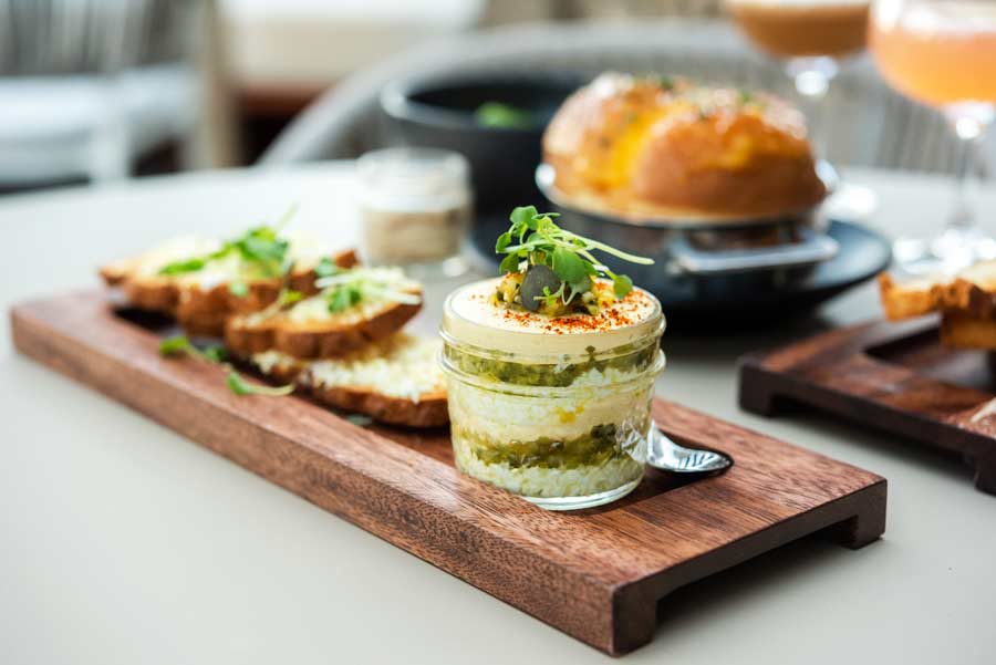 deconstructed deviled egg in a mason jar