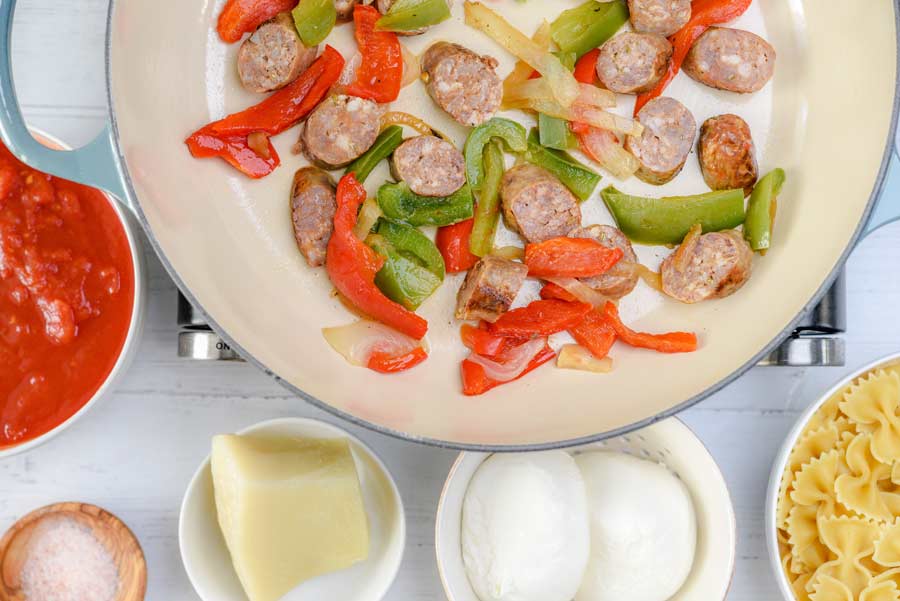 sausage and peppers in a pan