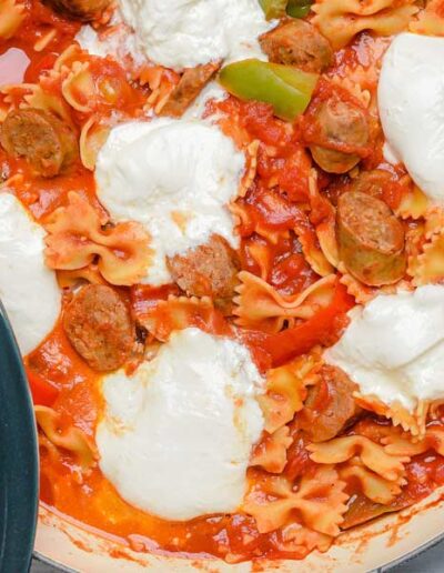 peppers sausage and pasta with burrata in a pan