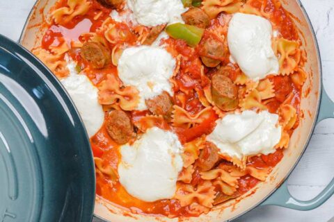 peppers sausage and pasta with burrata in a pan