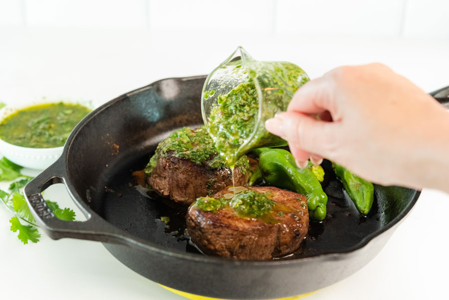 Pouring-Chimichurri-on-steak