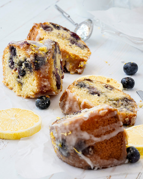 blueberry lemon cake with slices of fresh lemon