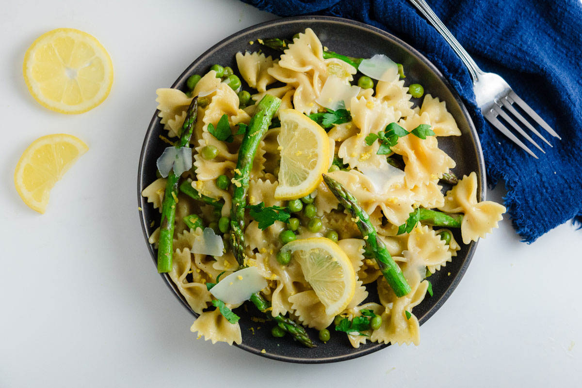 Asparagus-and-Pea-Pasta-with-Lemon-Sauce on a plate with fork