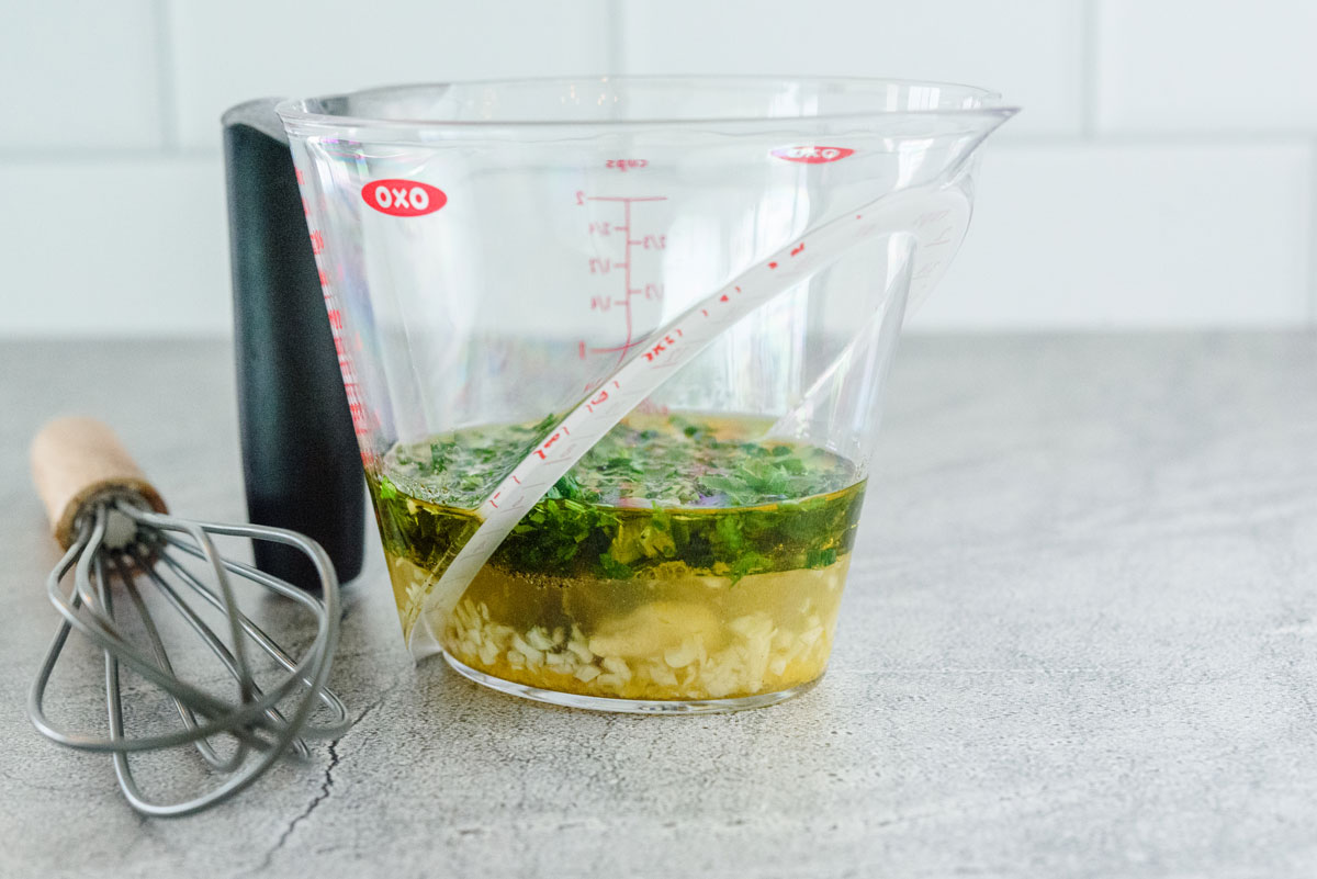 Lemon-herb-vinaigrette-in-measuring-cup