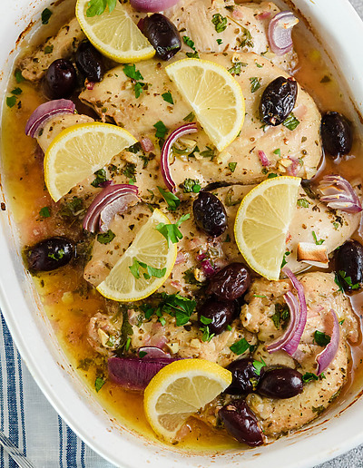 Mediterranean-Chicken with olives and lemons in a baking dish