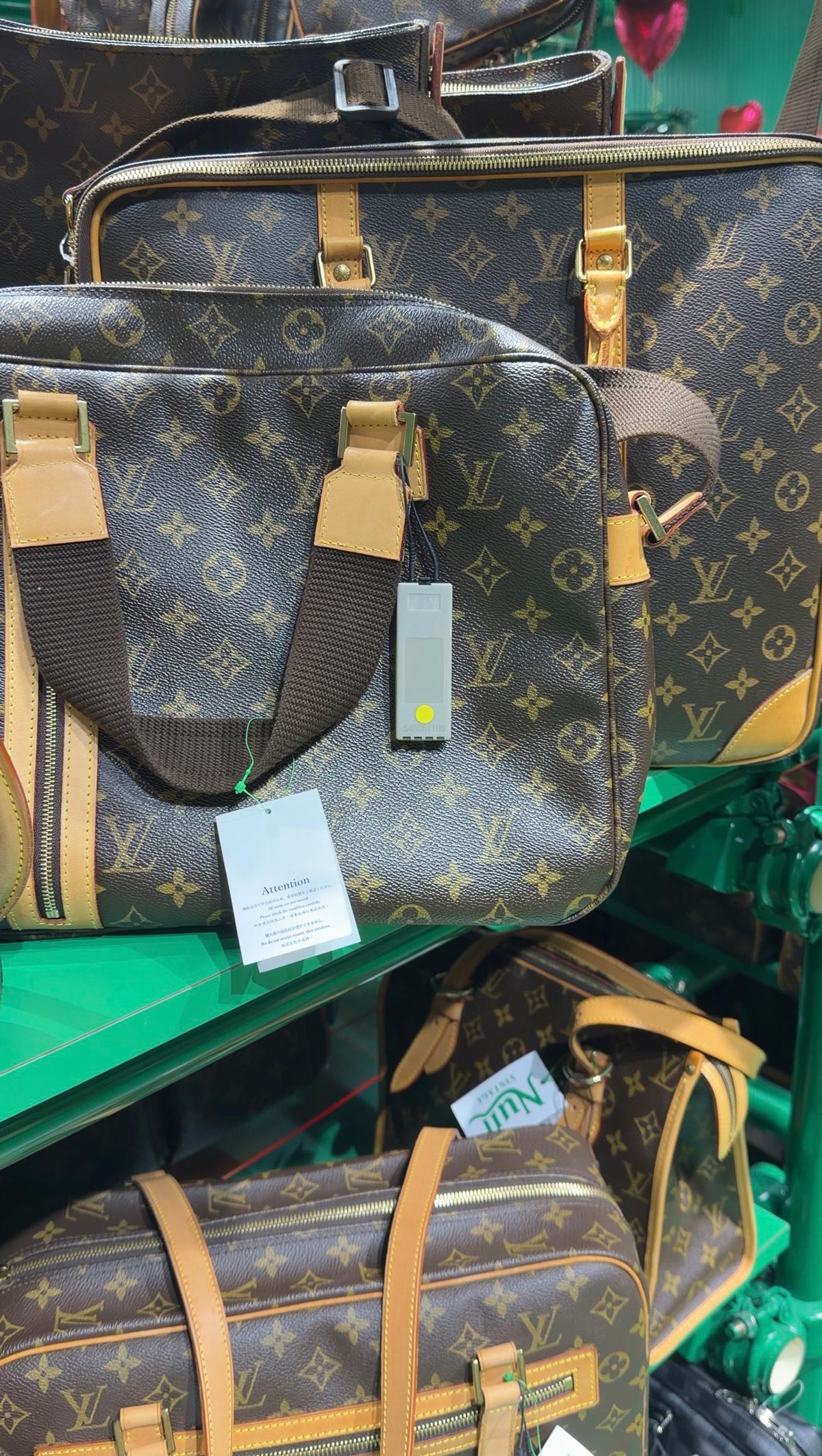 2nd-Hand Luxury Shopping in Tokyo & Osaka: Where I Found the Best Deals 4 Louis Vuitton bags displayed inside a 2nd-hand luxury store in Japan