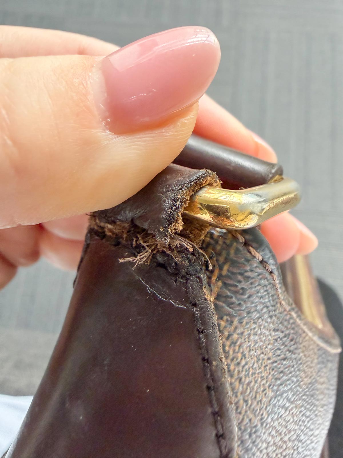 2nd-Hand Luxury Shopping in Tokyo & Osaka: Where I Found the Best Deals 6 Strap attachment damage on a Louis Vuitton bag before repair